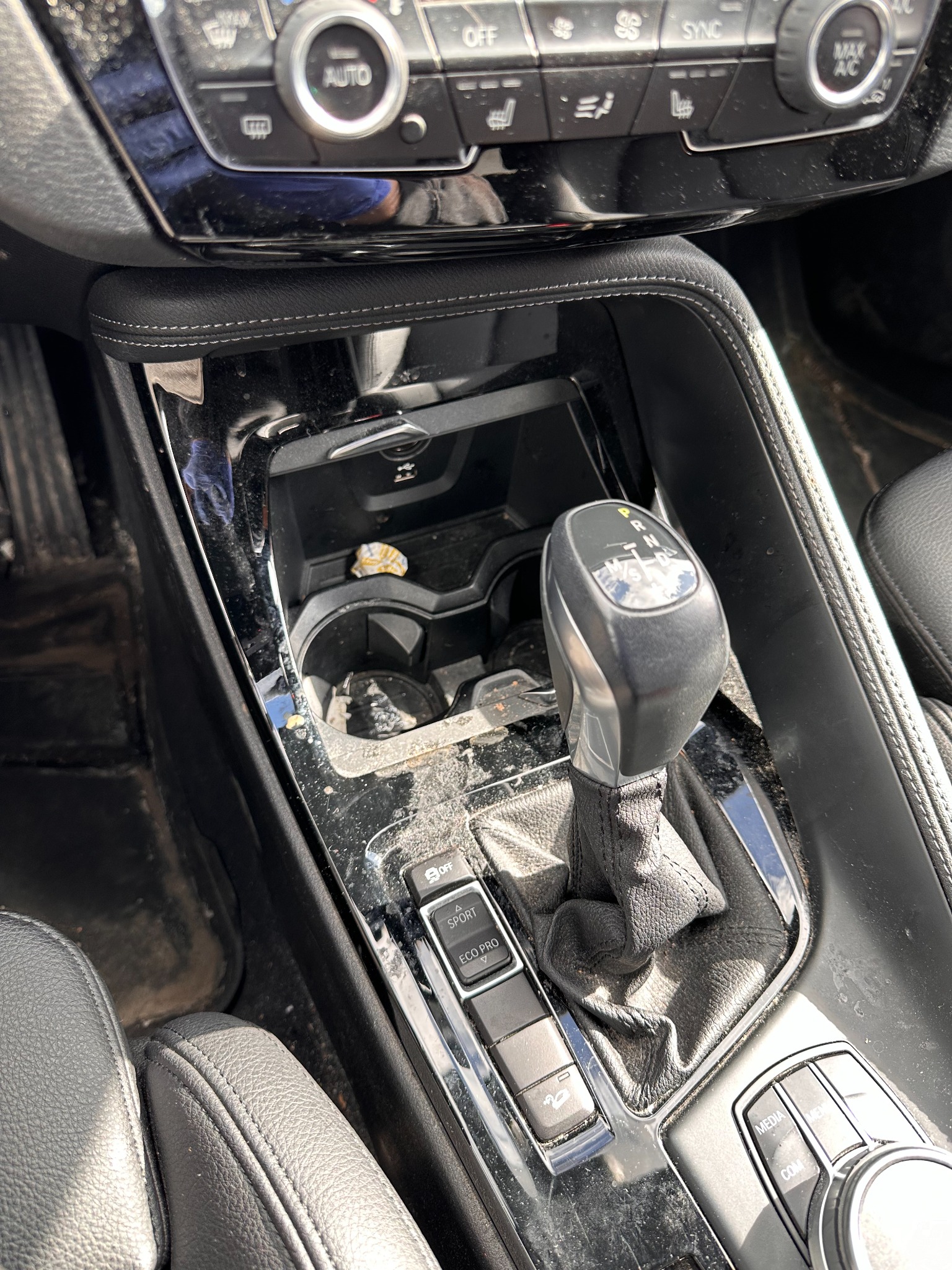 BMW center console before detailing